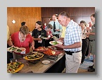 72  Larry Skog + others enjoying the opening dinner buffet  [SM]